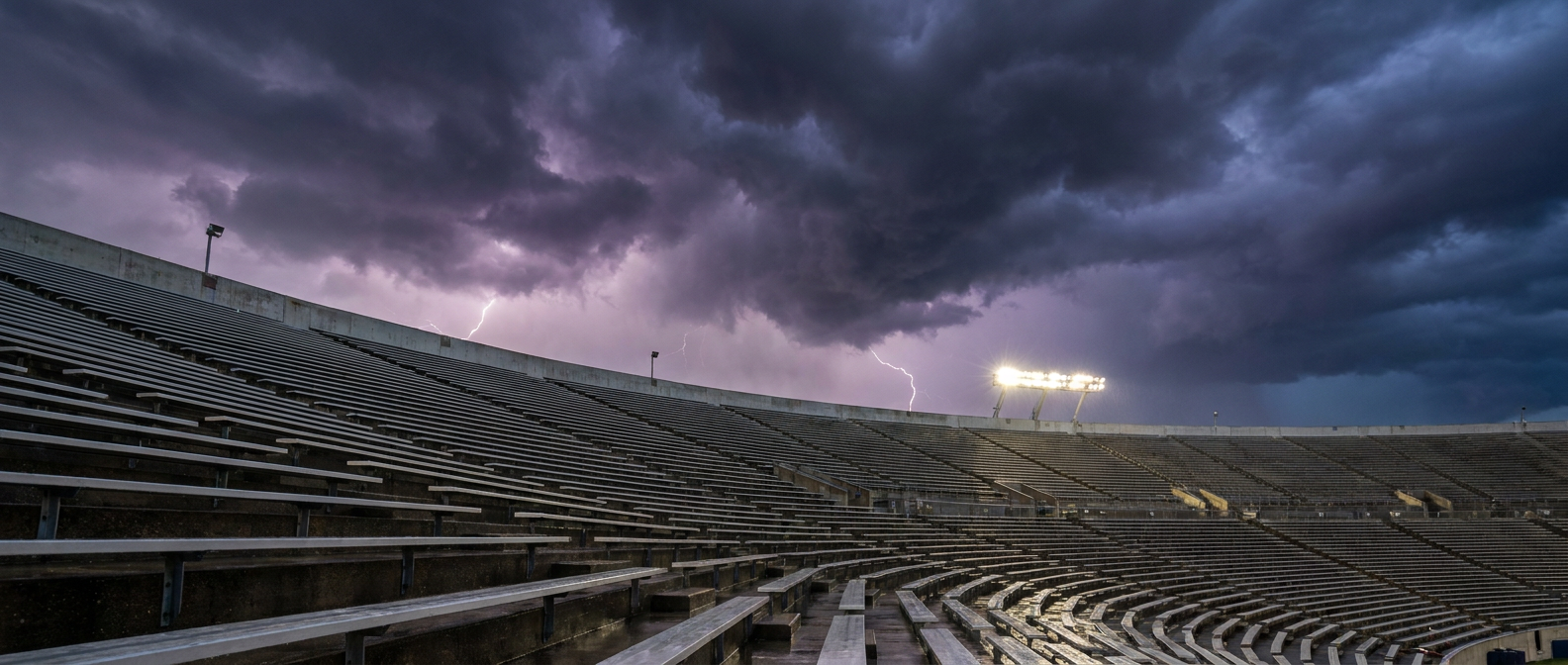 Empty stadium under storm clouds